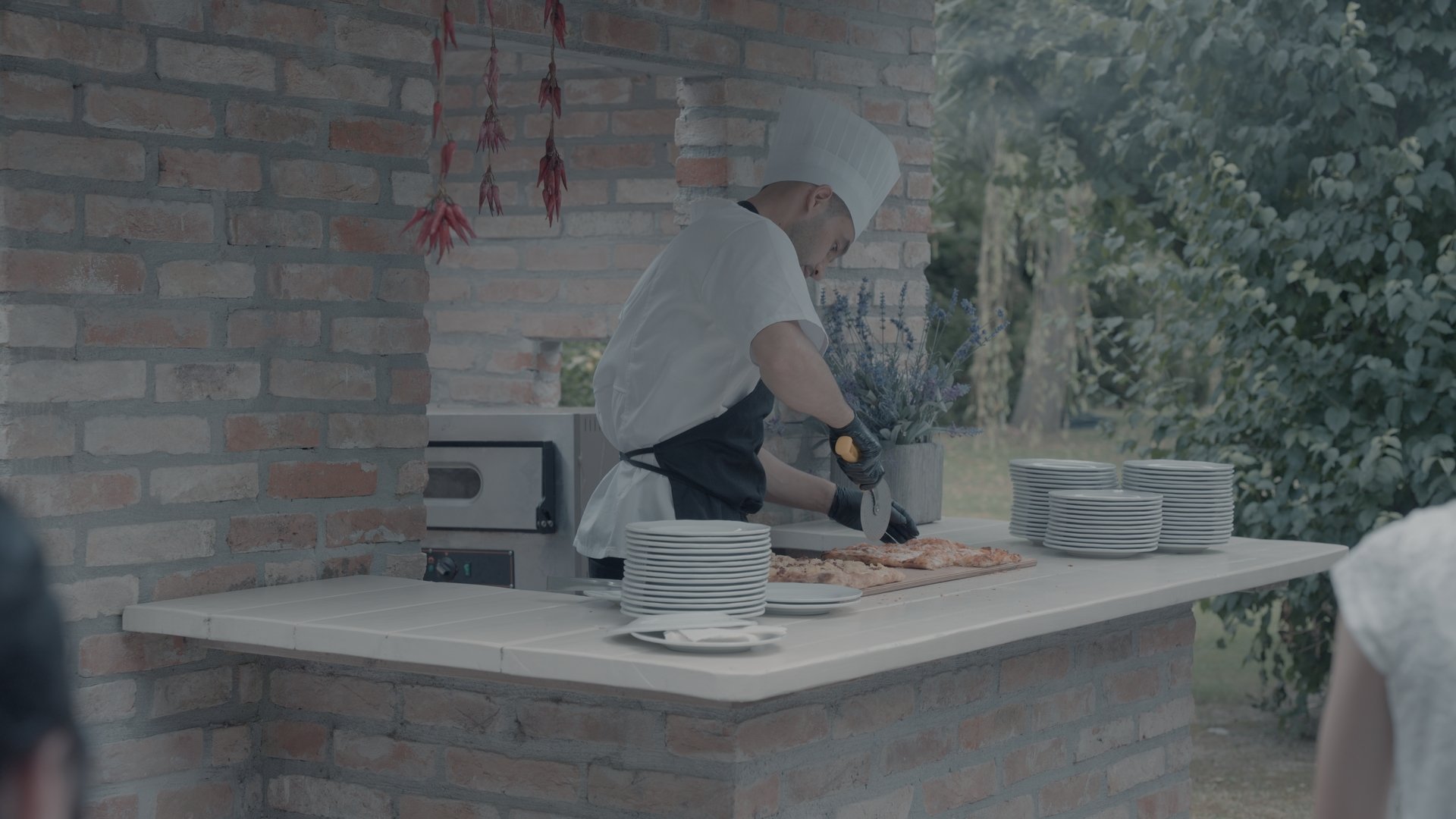 The same frame graded with the LUT from the prompt "cool pastel, muted brick, balanced soft look"